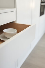 Poster - The white kitchen drawer features a minimalist design with home furniture incorporated into its sleek modern aesthetic and layout._00004_
