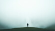 © Rafa Fernandez - Person in a dark coat stands before a misty waterfall, serene scene.