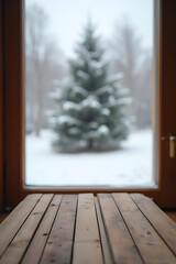 Aufkleber - A wooden table sits empty near a blurred window view, with a pine tree standing tall in a snowy winter scene._00004_