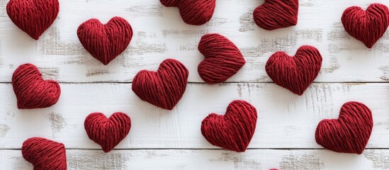 Poster - Red fabric hearts on white wooden background rustic vintage style ideal for romantic themes or advertisements with copy space for text
