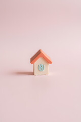 Poster - A small model house is selectively focused on a soft pastel colored background in this visually appealing image._00001_
