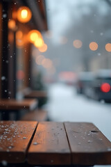 Aufkleber - A serene wooden table top stands empty amidst a winter wonderland scene of gentle snowfall and soft bokeh cafe lights._00001_