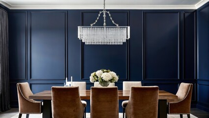Poster - An elegant dining room with deep navy walls where a polished oak table is surrounded by upholstered chairs in rich velvet. A simple yet stunning crystal chandelier provides a focal