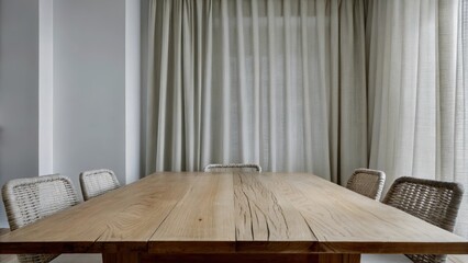 Poster - An airy dining space adorned with an oak table that showcases visible wood grain surrounded by wicker chairs with linen curtains gently filtering light and emphasizing the subtle
