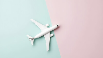 Poster - A model airplane sits next to a plane on soft pastel colored backgrounds in a flat lay composition._00003_