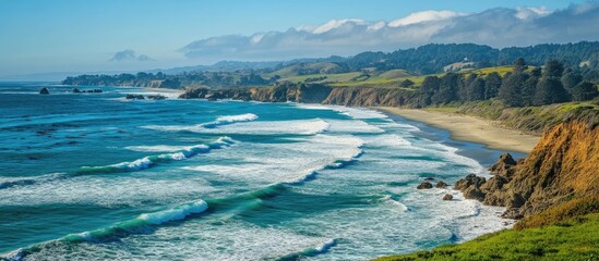 Poster - Coastline with vibrant blue waves crashing onto the shore amidst lush greenery and coastal cliffs under a clear blue sky