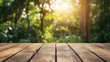 Leinwandbilder - Close up of wooden table surface in a sunlit forest setting with blurred greenery in the background for natural ambiance and warmth