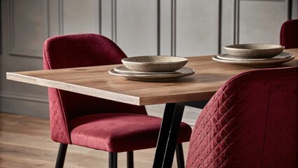 Poster - A bright dining area showcasing a table made of reclaimed wood set with stonelike dishes in understated beige and accompanied by chairs upholstered in warm clay fabric.