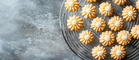 Poster - Gingerbread cookies arranged on a wire rack showcasing decorative patterns against a textured grey stone countertop background
