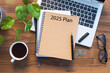 © Hazal - Note book with 2025 goals text on it to apply new year resolutions and plan.