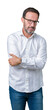 © Krakenimages.com - Handsome middle age elegant senior business man wearing glasses over isolated background skeptic and nervous, disapproving expression on face with crossed arms. Negative person.