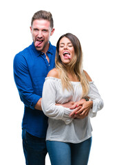 Wall Mural - Young couple in love over isolated background sticking tongue out happy with funny expression. Emotion concept.