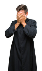 Sticker - Young catholic christian priest man over isolated background with sad expression covering face with hands while crying. Depression concept.