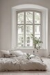 © Media Srock - Linen bedding in a bright minimalist bedroom near a large window