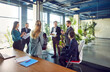 © Studio Romantic - Young diverse people group of company employees talking on business meeting sitting in modern office during a conference, discussing new job projects or startups. Teamwork concept.