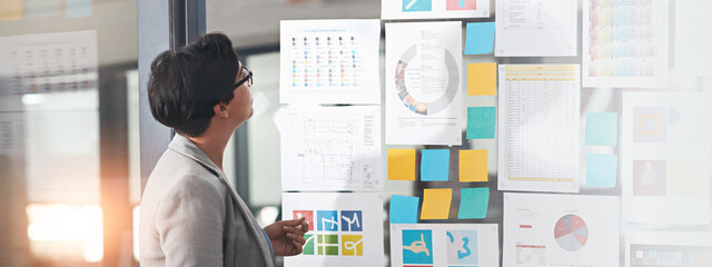 Poster - Woman, sticky notes and office for thinking on research, problem solving and vision for campaign. Female person, contemplating statistics and glass wall for solution, brainstorming and mood board