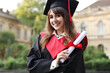 © New Africa - Happy student with diploma after graduation ceremony outdoors
