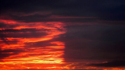 Poster - Abstract dark red and yellow sky background with burning sky effect, and rays of sunlight during sunset. Topics: hot colors, cloudy background, weather, meteorology, climate, air space, atmosphere