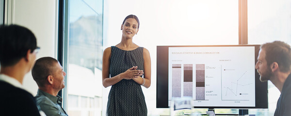 Poster - Woman, screen and presentation with team in boardroom, charts and review for b2b sales strategy. Speaker, monitor and graphs with brand communication, above and discussion with group in modern office