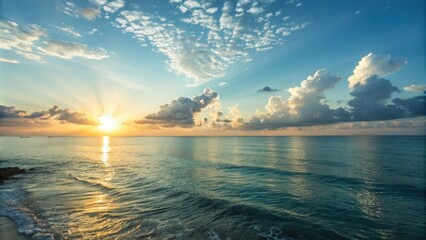 Wall Mural - golden sunrise illuminating a calm ocean, with soft clouds and radiant sunrays creating a stunning s