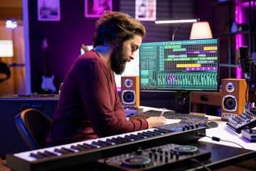 Poster - Musical producer composing new lyrics for songs and recording music with audio devices in home studio. Singer songwriter writes material by taking notes and creating rhymes or melodies.