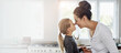 © peopleimages.com - Happy mom, kid and touch nose for love, care or family connection with parent in home kitchen. Smile, girl and mother holding hands with child for support, trust and bonding together with daughter