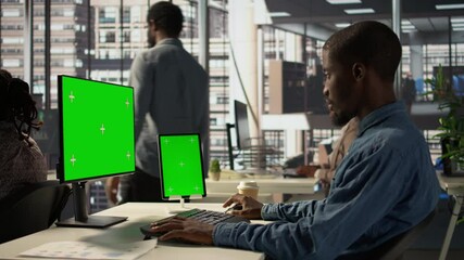Poster - black businessman analyzing financial data next to chroma key screen, reviewing company strategies o