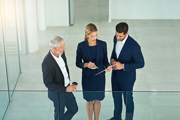 Poster - Above, tablet and business people in office, accounting and conversation with planning for project. Taxes, financial consultant and employees in workplace, tech and connection with online reading