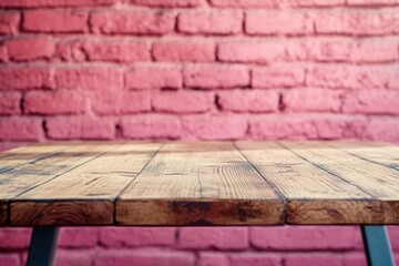 Poster - Wooden table in front of a pink brick wall.
