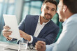 © peopleimages.com - Tablet, conversation and business men in office with research for online stock market investment. Discussion, meeting and financial advisors with digital technology for company capital gain proposal.