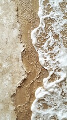 Poster - Waves softly caress the sandy shoreline, creating a peaceful ambiance. The interplay of light and texture reveals the serenity found at the water's edge, inviting reflection and calm