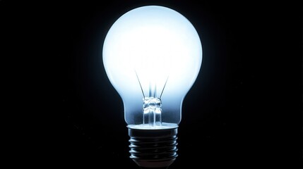 Poster - A glowing light bulb with blurred edges, its warm light softly blending into a dark background, creating an inviting atmosphere