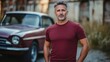 © bird_saranyoo - a middle-aged man in burgundy, standing near a vintage car