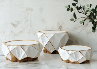 Aufkleber - Three geometric white and gold display stands on marble surface with eucalyptus branch.