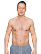 © Krakenimages.com - Handsome young man wearing swimwear shirtless sticking tongue out happy with funny expression. emotion concept.