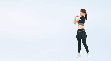 Aufkleber - スポーツウェアを着てストレッチする女性の全身写真