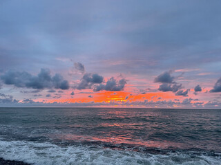 Wall Mural - beautiful red and orange sunset with sea and clouds
