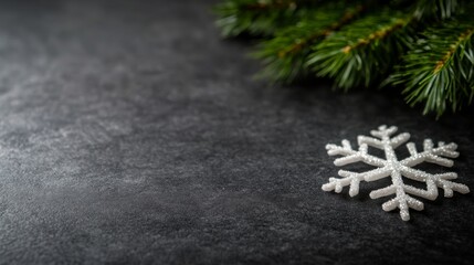 Aufkleber - A green fir tree branch is beautifully adorned with a snowflake ornament, set against a dark background, perfect for seasonal greetings and winter themes