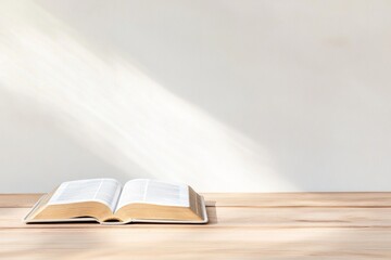Poster - Open Book on Sunlit Wooden Table in Warm, Minimalist Setting