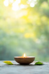 Poster - Glowing Candle on Wooden Surface with Blurred Nature Background
