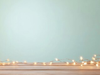 Poster - Minimalist Festive Lights on Wooden Surface Against Soft Blue Background
