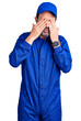 © Krakenimages.com - Middle age handsome man wearing mechanic uniform rubbing eyes for fatigue and headache, sleepy and tired expression. vision problem