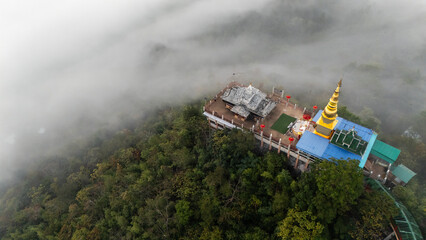 Wall Mural - Aerial view of Wat Phra Phutthabat Pha Nam temple in Li district, Lamphun province of Thailand during morning.