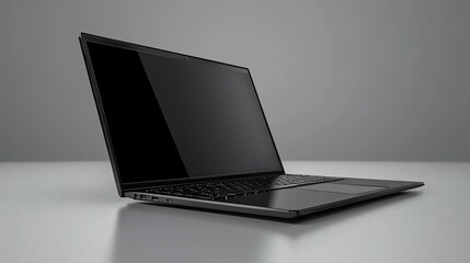 Poster - Sleek black laptop angled on grey surface.