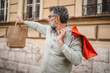 © Miljan Živković - senior man hold shopping bags and looking for somebody on the street