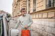 © Miljan Živković - senior man hold shopping bags and unlock the car ready to go home