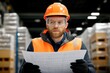 © Andrii  - Engineer with Safety Goggles Assessing Logistics Paperwork