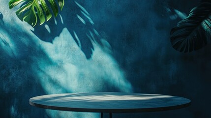 Aufkleber - A serene tabletop scene with lush green leaves against a textured blue wall.