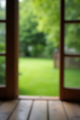 Poster - A wood table in a green garden is blurred out of focus while viewed through a window as a distant background._00002_