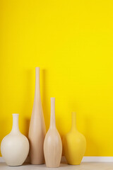 Poster - A bright yellow wall serves as a cheerful and vibrant background for various decorating styles in interior design settings._00002_